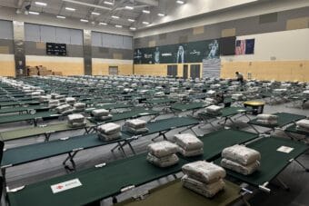 Cots line the floor at the Alaska Airlines Center on the campus of the University of Alaska Anchorage.