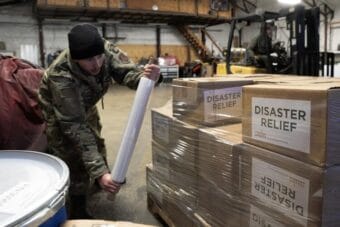Alaska Organized Militia personnel, assigned to Task Force Bethel, prepare relief supplies for distribution to nearby villages during post-storm recovery efforts for Operation Halong Response at Bethel, Alaska on Nov 19, 2025.