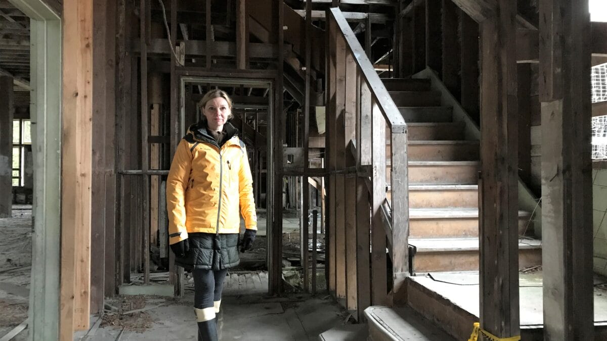 woman standing in unfinished house