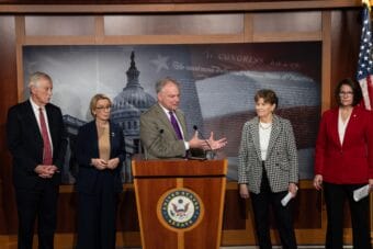 Sen. Tim Kaine, D-Va., speaks during a press conference following a vote on Capitol Hill on Sunday. The Senate convened for a rare Sunday session in an attempt to end the government shutdown.