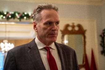 Gov. Mike Dunleavy speaks to reporters ahead of his annual holiday open house on Tuesday, Dec. 10, 2024 in Juneau.