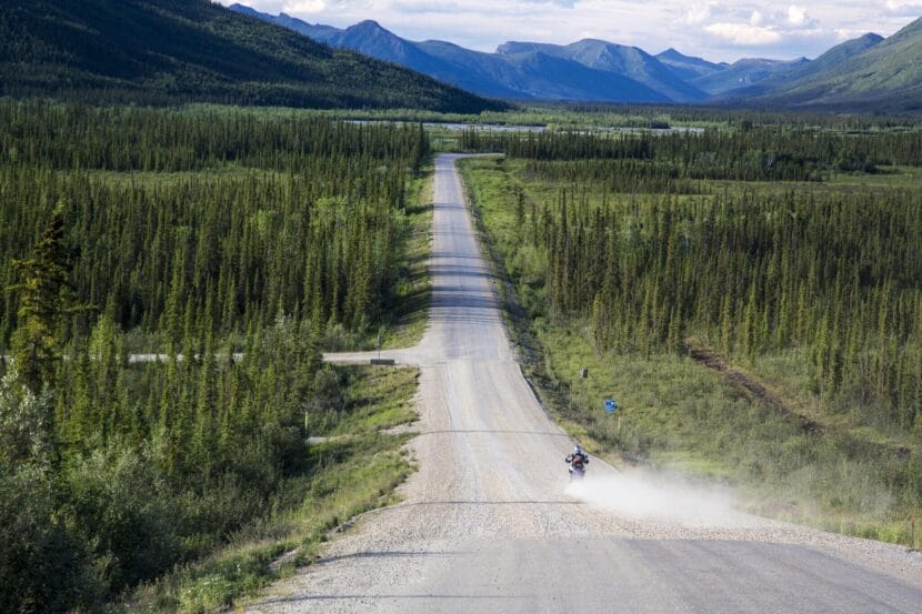 A motorcyclist descends a hill as he approaches Coldfoot, Alaska on the Dalton Highway in 2014.