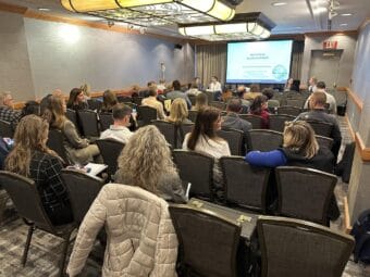 Attendees watch during a breakout session at the kickoff of Alaska's Rural Health Transformation Program in Anchorage on Jan. 15, 2025.