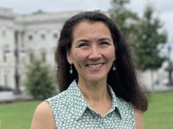 woman with long dark hair outside