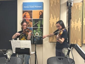 Maya Breedlove and Ysabel Wilson from Juneau String Ensembles on Juneau Afternoon, February 25, 2026. (Bostin Christopher/KTOO)