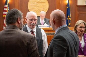 people huddled in legislative chamber