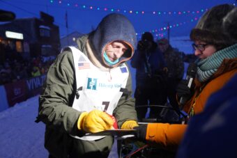 Iditarod Trail Sled Dog Race champion Jessie Holmes signs in after finishing the 1,000-mile race in Nome the evening of Tuesday, March 17, 2026.