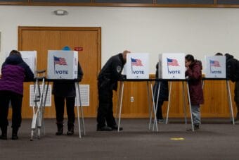 Voters fill out ballots at Bethel's Precinct 1 in the Yupiit Piciryarait Cultural Center on Nov. 5, 2024. (MaryCait Dolan/KYUK)