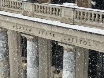 Snow falls on the Alaska State Capitol