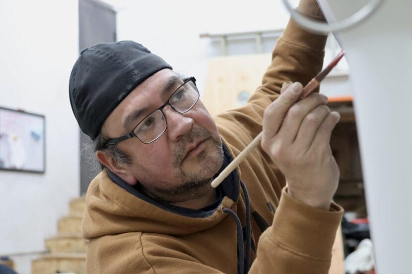 John Garcia III paints Petersburg’s killer whale canoe (kéet yaakw) on March 7, 2026.
