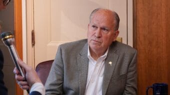 Alaska Gov. Bill Walker listens to a question from KTOO and Alaska Public Media reporter Andrew Kitchenman from his Capitol office in Juneau on June 19, 2018.
