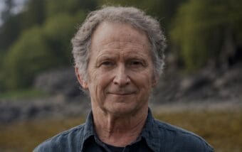 man with grey curly hair
