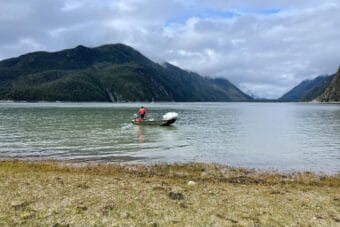 Liam Wirak Cassidy, who collects samples to track paralytic shellfish toxins for the Chilkoot Indian Association, participating in a beach cleanup in spring 2025.