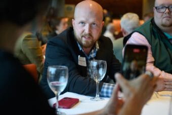 Jonathan Kreiss-Tomkins answers a question at his table during the Commonwealth North Gubernatorial Candidate Meet & Greet event at Wildbirch Hotel in Anchorage on Monday, July 20.