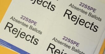 Reject stickers await ballot envelopes Wednesday, June 15, 2022 at the Division 1 office of the Alaska Division of Elections in Juneau, Alaska during counting for Alaska's special U.S. House primary election.