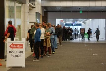Voters line up on Aug. 17, 2026, at the early voting station set up in Anchorage’s Midtown Mall. Voters reported waiting about an hour to cast their primary election ballots.