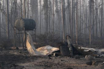 A charred oil tank left over from a house that burned in the Mukluk Fire.