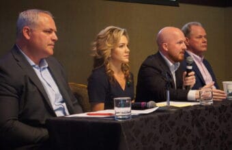 Former state Rep. Jonathan Kreiss-Tomkins, third from left, speaks at a gubernatorial candidate forum on Wednesday, while former Attorney General Treg Taylor, Anchorage business owner and talk-show host Bernadette Wilson and former Anchorage Mayor Dave Bronson listen. The forum was held by the Alaska Hospital and Healthcare Association and the organization's annual conference in Girdwood. Taylor, Wilson and Bronson are Republicans. Kreiss-Tomkins is a Democrat.