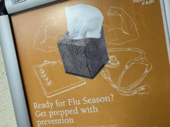 A poster in Juneau’s Dimond Courthouse on Friday, Sept. 18, 2026, advises anti-flu measures.