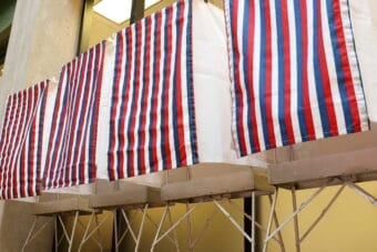 Voting booths stand in the State Office Building in Juneau on primary day, Aug. 18, 2026.