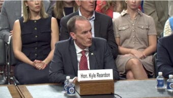 man in suit at a table