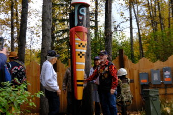 The chief of the Valdez Native Tribe Bill Smith (right) and other veterans unveil a new monument at the Alaska Native Heritage Center’s Ngíisdla Garden on Sunday, Sept. 27.