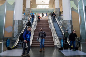 Passengers arrive at the Ted Stevens Anchorage International Airport on April 20, 2022, a day after masks became optional on flights. (Jeff Chen/Alaska Public Media)