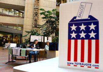 Volunteers operate an in-person polling place for the special U.S. House primary election on Friday, May 27, 2022 in the atrium of the State Office Building at Juneau, Alaska.