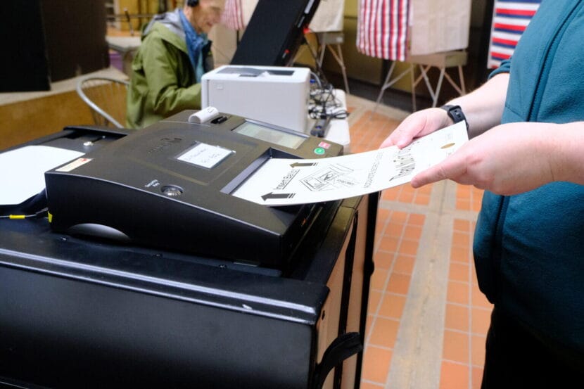 A voter casts their ballot on the first day of early in person voting in Juneau on Oct. 19, 2026.